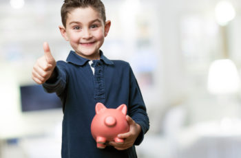 OBCAE70 1 350x230 - little kid holding a piggy bank